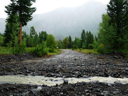 Favorite Moments from Pagosa Springs Road washed out by a rocky creek