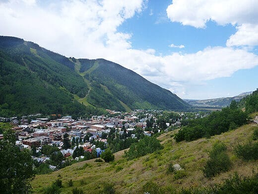 Road Trip Through Southern Colorado Grassy slopes above the village of Telluride