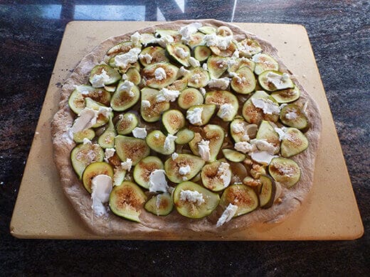 Roasted Fig Pizza with Caramelized Onion and Goat Cheese Smear creamy goat cheese over pizza