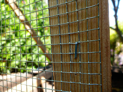 The Nuts and Bolts of the Tiki Coop Attaching hardware cloth to the framing