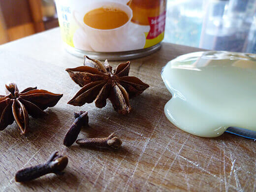 Star anise, cloves, and sweetened condensed milk