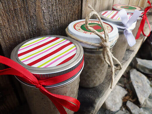Jars of homemade chai concentrate prettied up with ribbon and paper