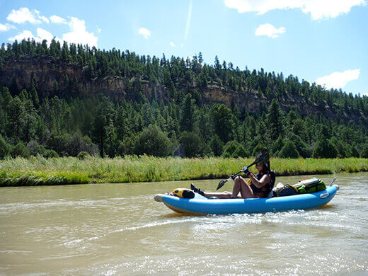 Kayak Camping on the Rio Chama Paddling through the evergreen-filled Chama Canyon