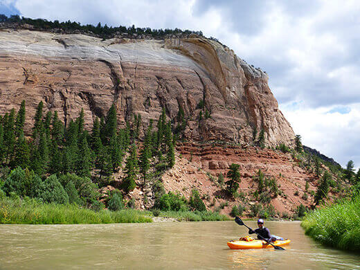 Kayak Camping on the Rio Chama Sandstone cliffs in Chama Canyon