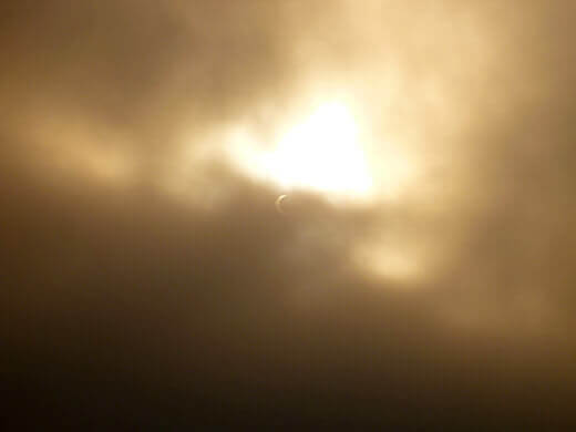 Chasing the Solar Eclipse The sun peeking out from behind the clouds