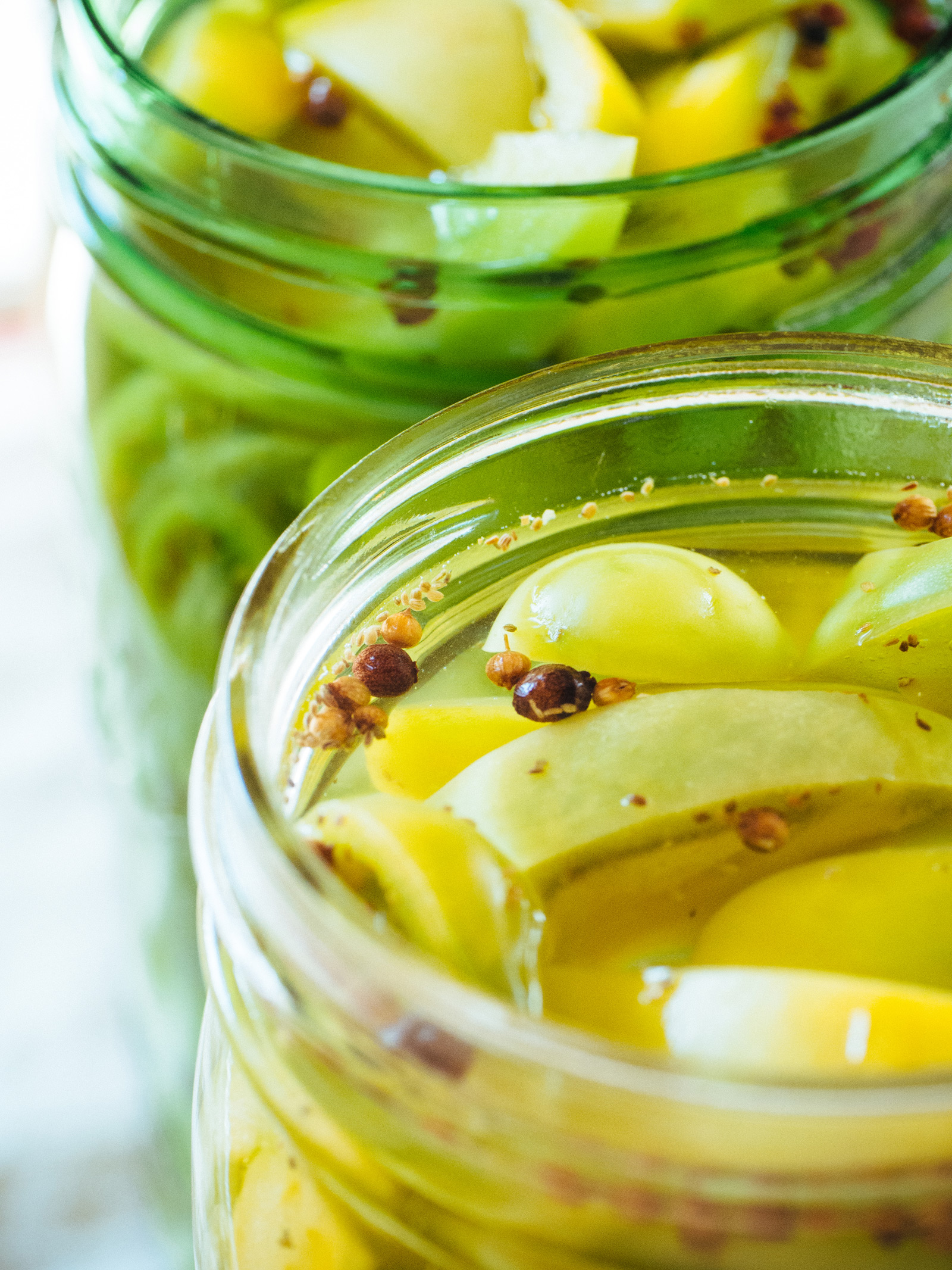 Green tomatoes in pickling brine
