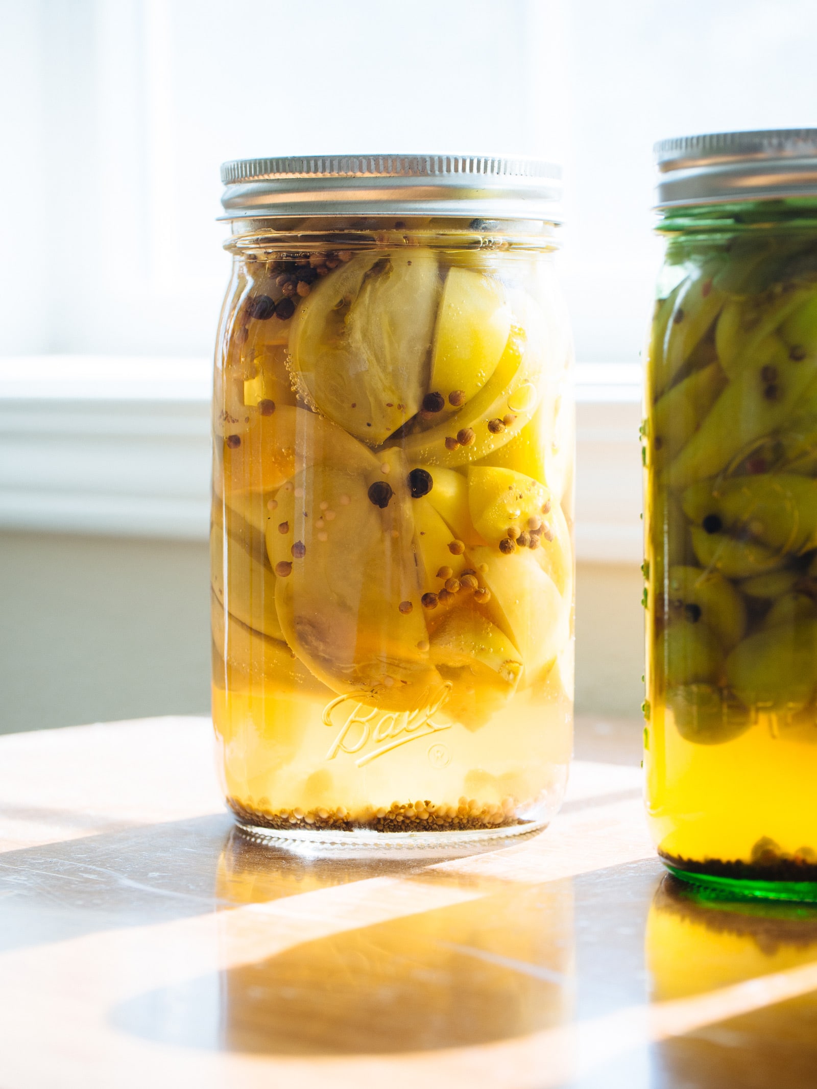 Jars of pickled green tomatoes