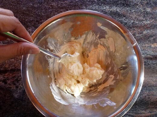 Mix well until the frosting is smooth and even