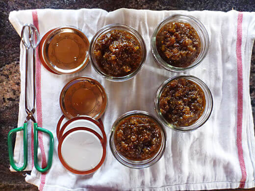 Ladle jam into hot sterilized jars