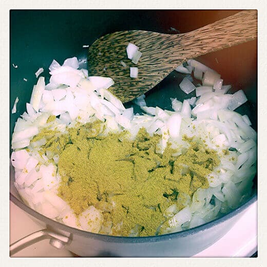 Stir curry powder into pot