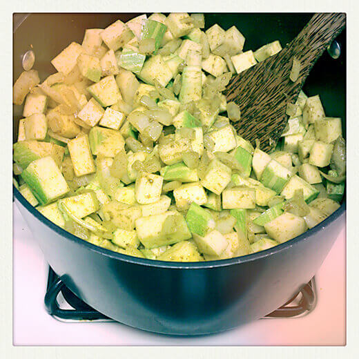 Pour in chicken broth and bring to a boil