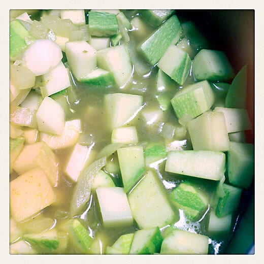 Pour in broth and bring the mixture to a boil