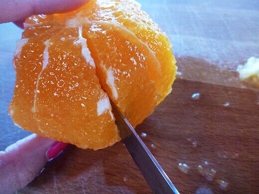 Slice along the membrane to separate the fruit segment