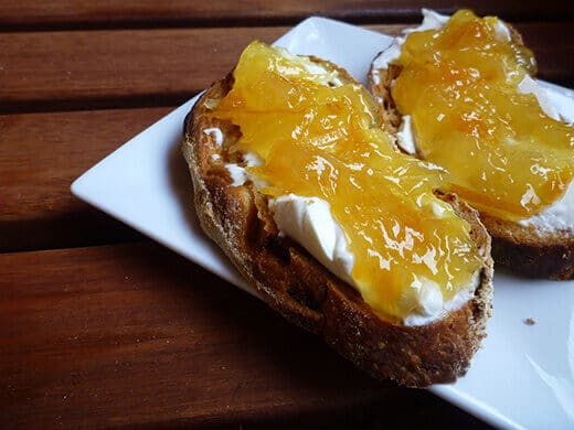 Orange-grapefruit-ginger marmalade with cream cheese and toast