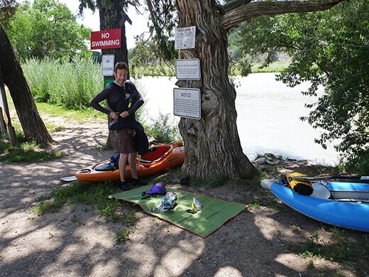 Packing our kayaks for three days of camping on the river