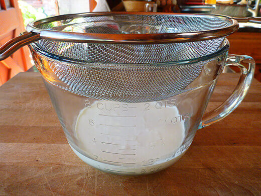 Pour cold heavy cream into a bowl and fit with a sieve