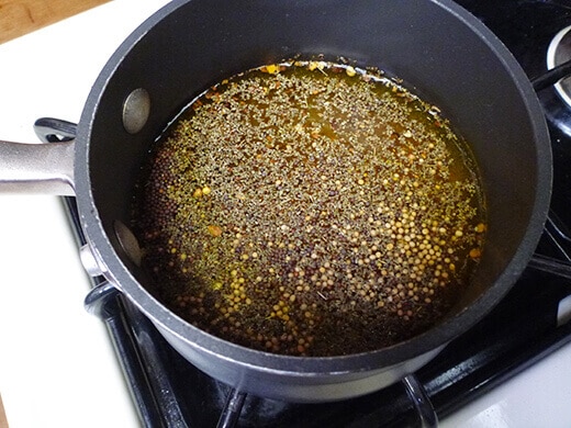 Heat vinegar, water and spices