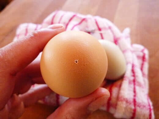 Pin prick in the large end of an egg