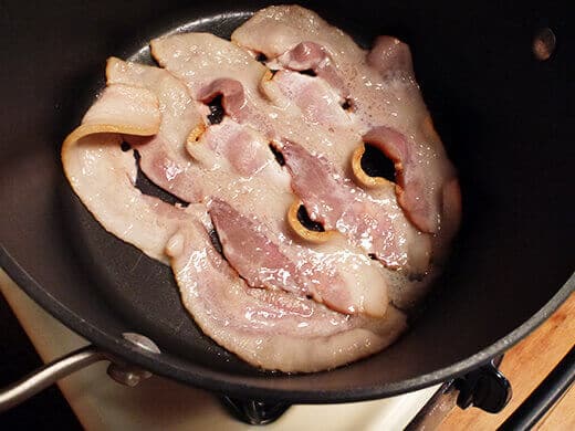 Fry bacon until crisp