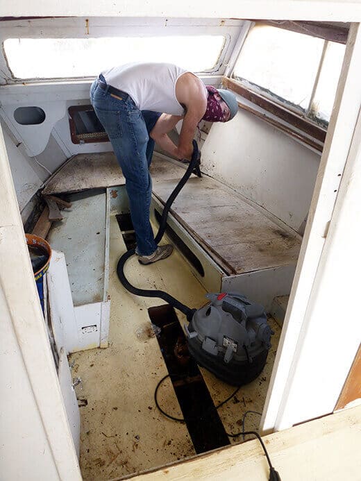 Vacuuming under all the old boards