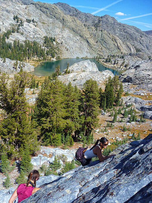 Scrambling up a slope with Ediza Lake in the distance