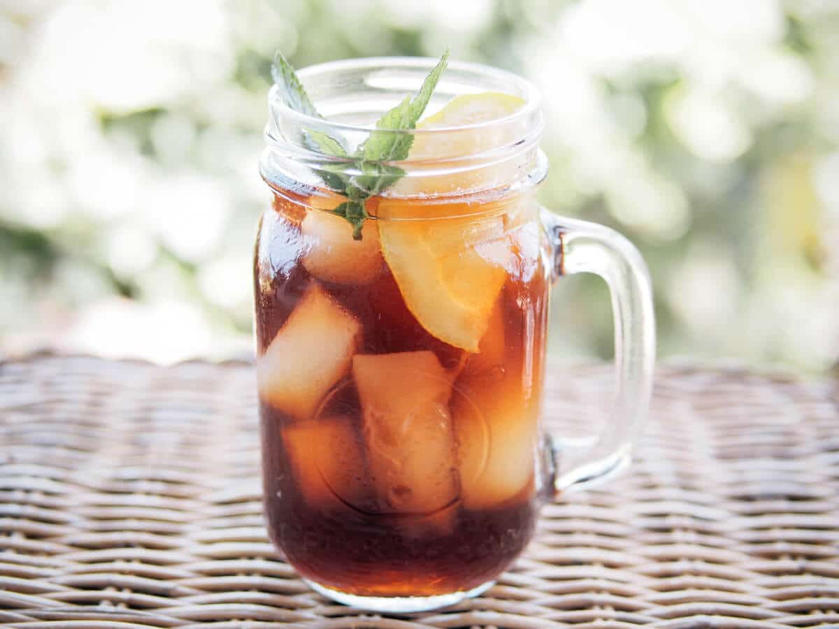 Iced Tea In Plastic Cup With Lemon And Mint Stock Photo, Picture