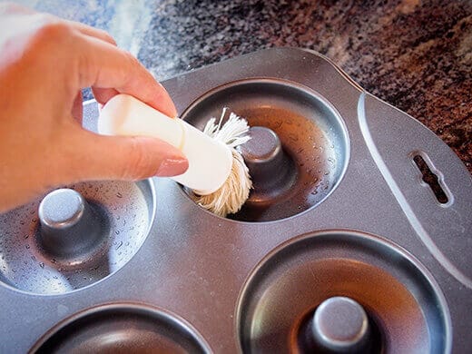 Lightly oil donut pan