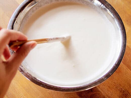 Stir heavy cream into milk mixture