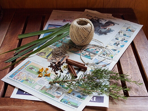 Newspaper, twine, spices and herbs