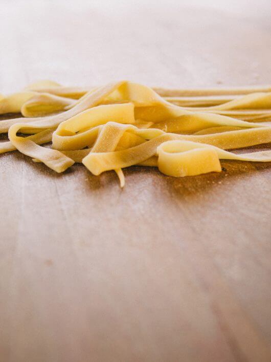 Dust the noodles with flour