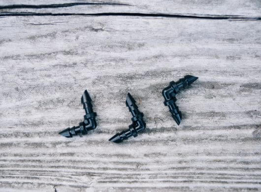 Barbed elbow fittings