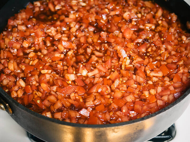 Tomato jam simmering on the stove