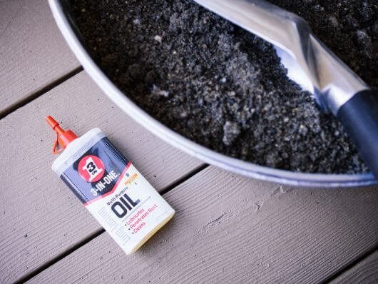 Fill a bucket with sand and oil to keep tools clean and sharp