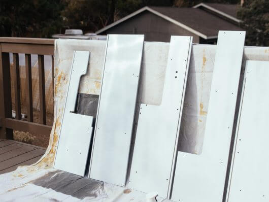 Newly painted play kitchen cabinets