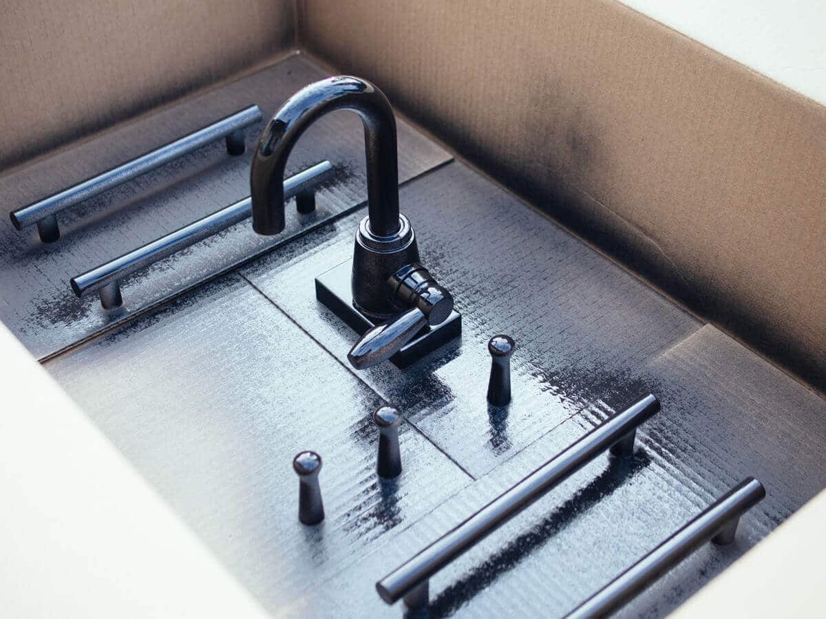 Play kitchen fixtures spray painted matte black