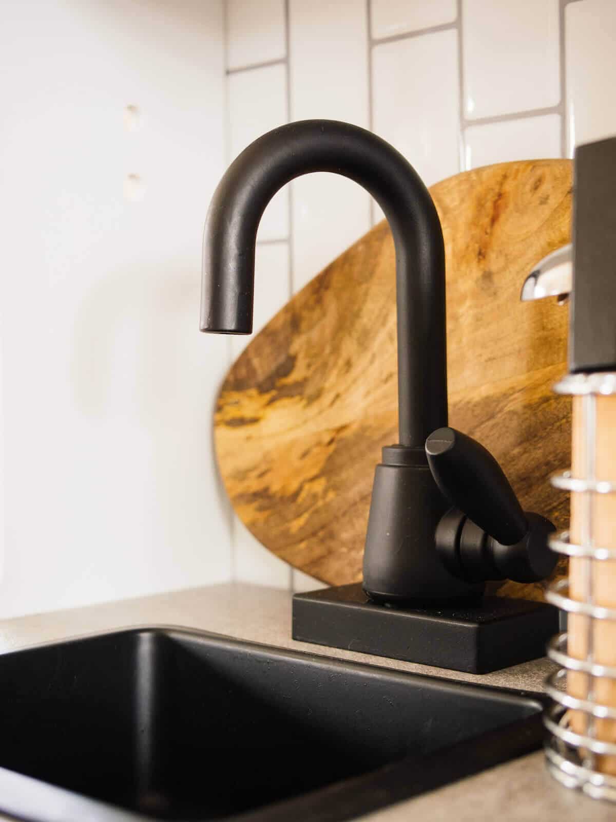 Matte black fixtures in a play kitchen