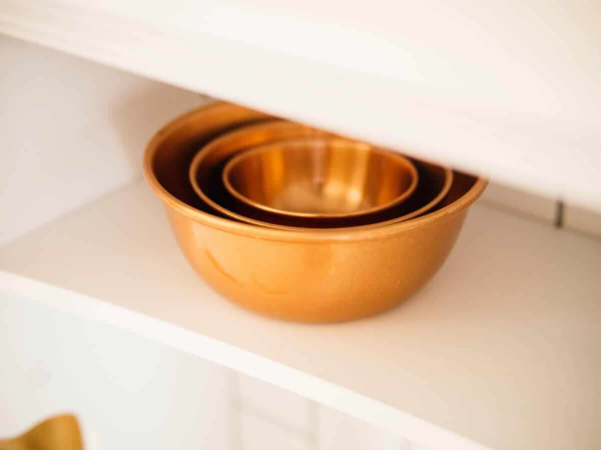 Open shelving with copper bowls