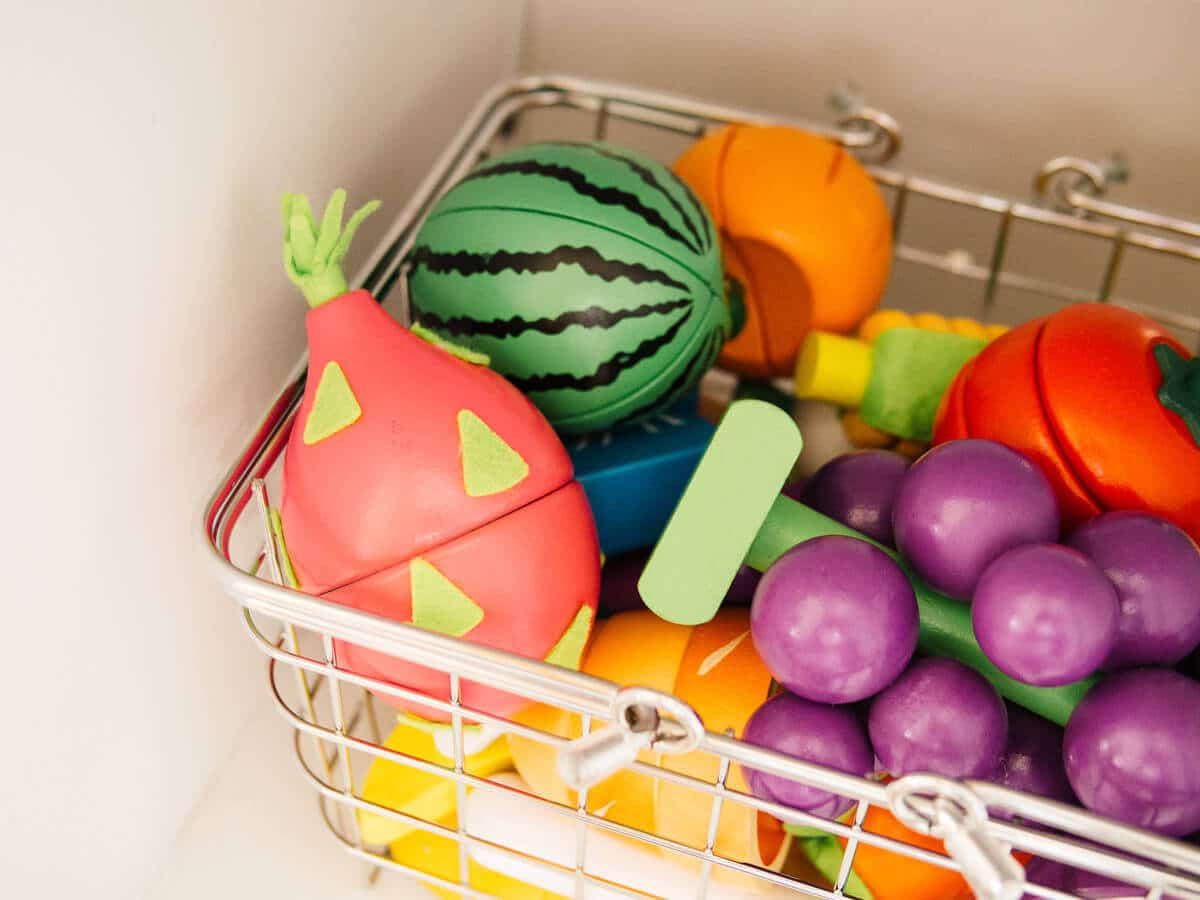 Wooden magnetic play food in wire basket
