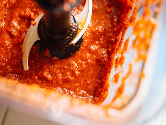 Blend gochugaru with the apple, onions, and aromatics to make kimchi sauce