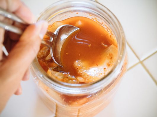 Tamp down on the vegetables to expel more liquid