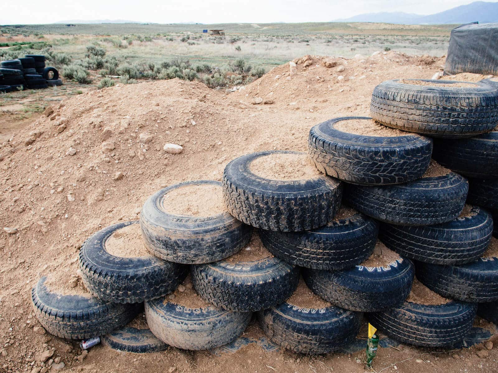 Thousands of pounds of dirt pounded into used tires to create walls