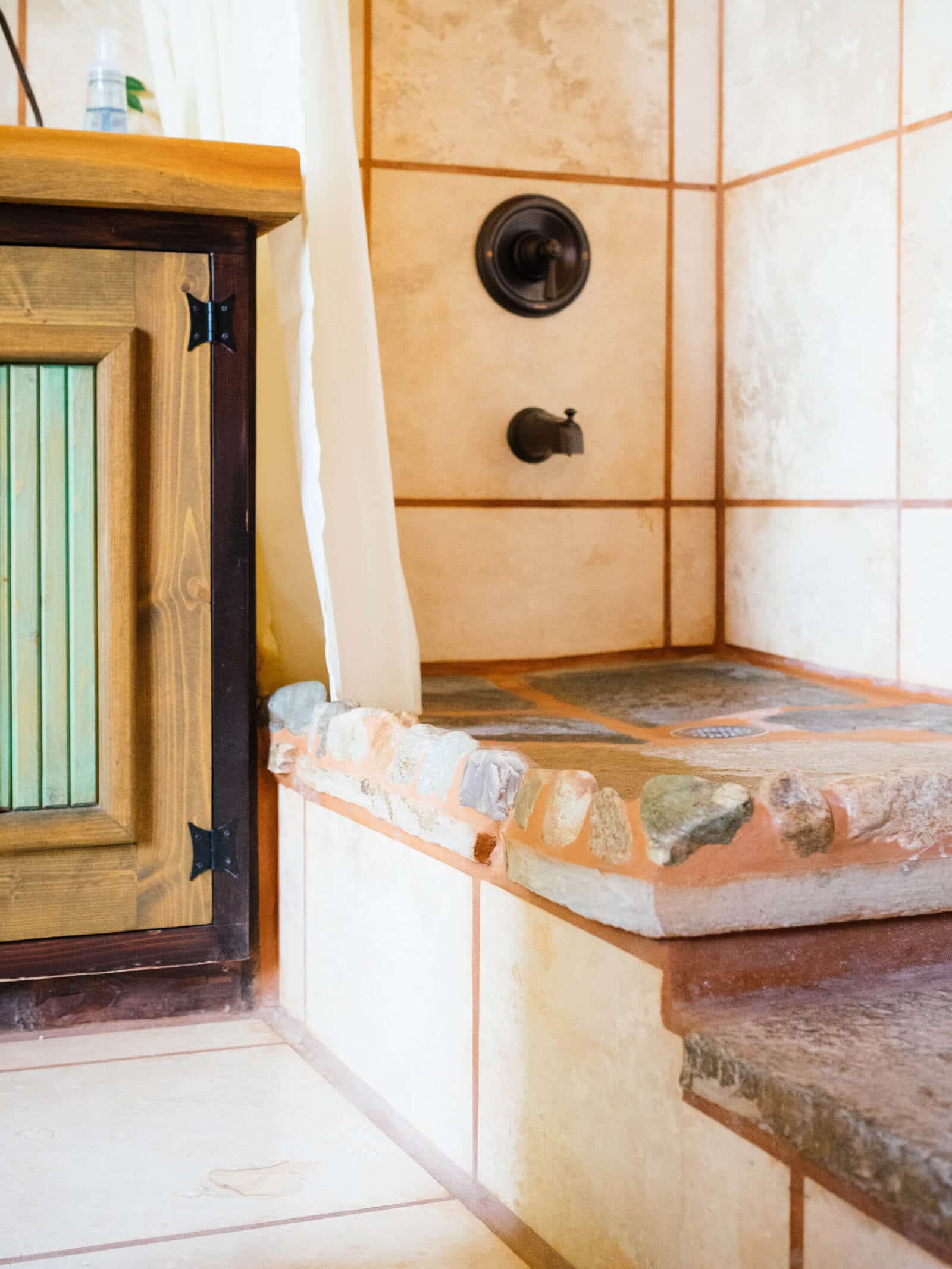 Hand-laid stones in an Earthship bathroom