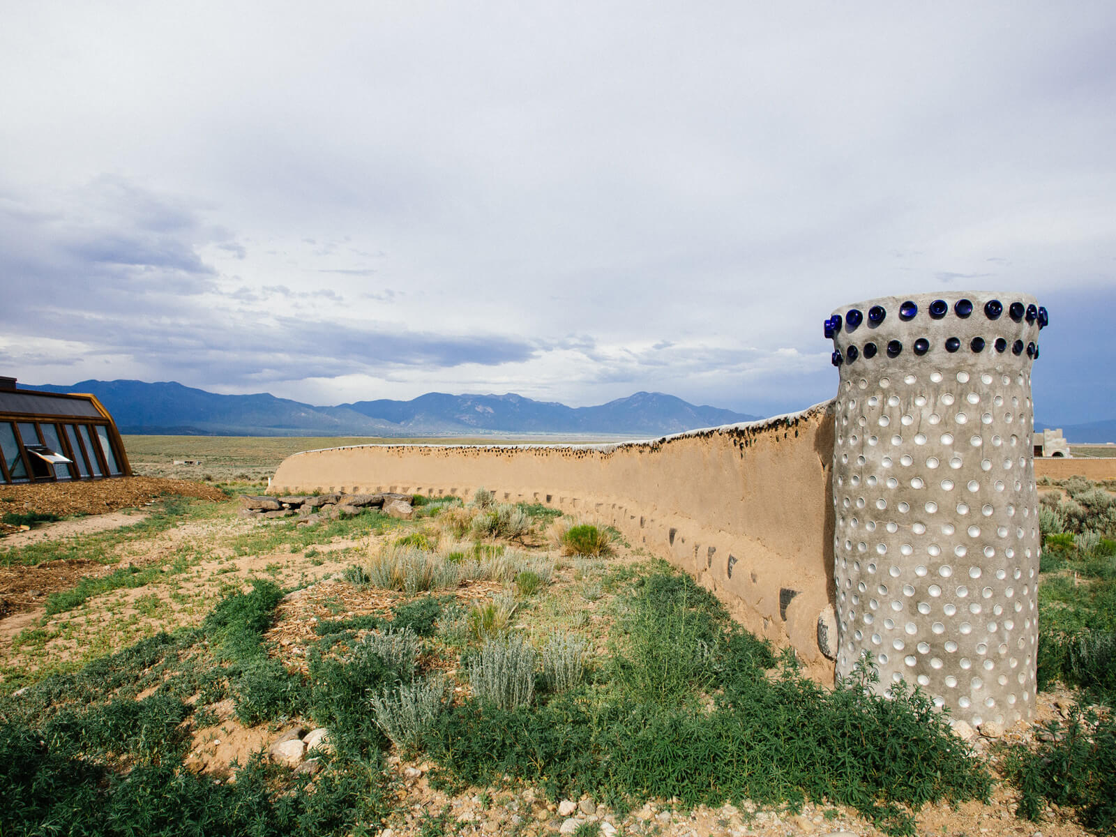 Adobe mud wall made from recycled cans and bottles
