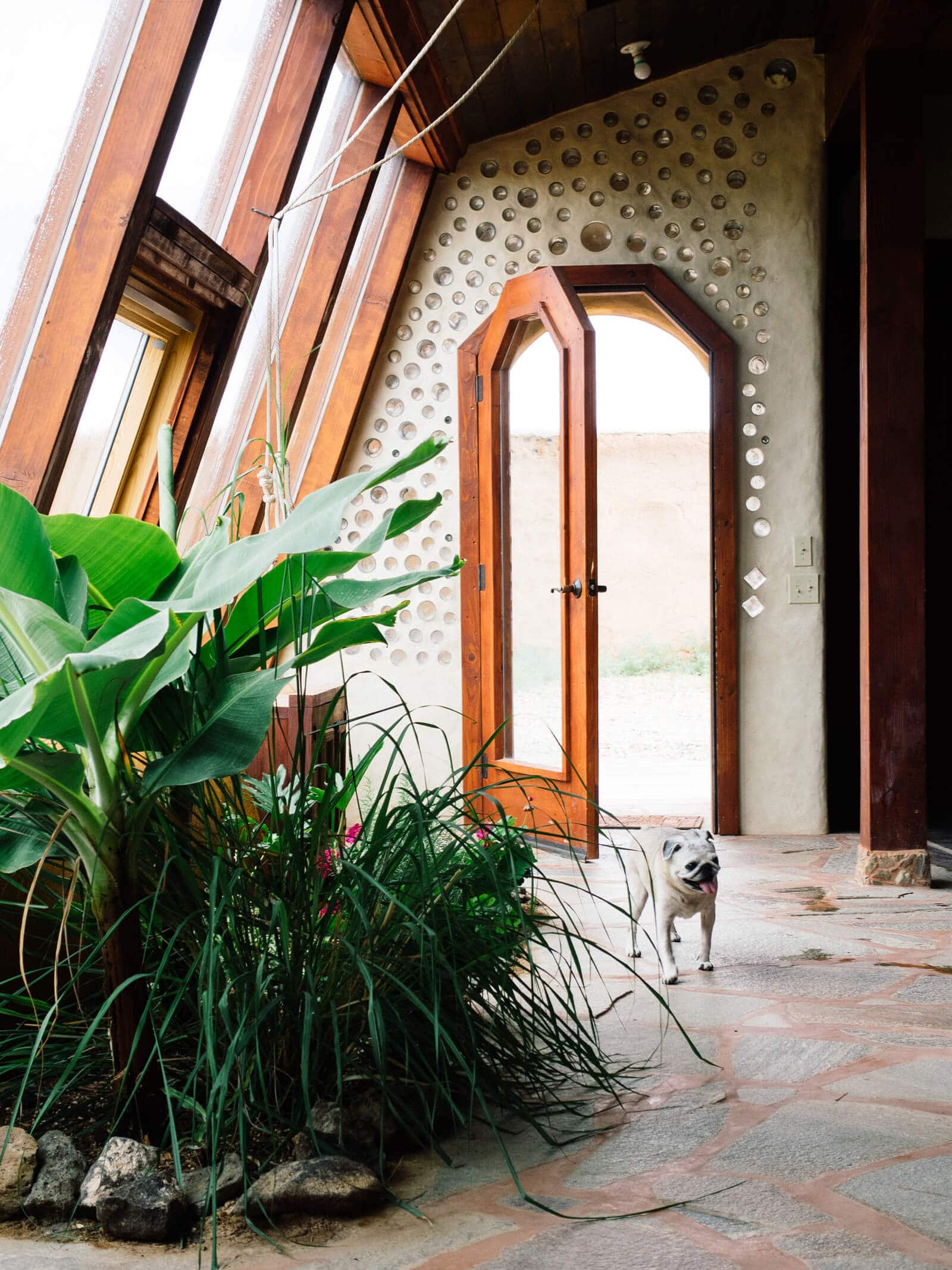 Entering the garage of an Earthship home