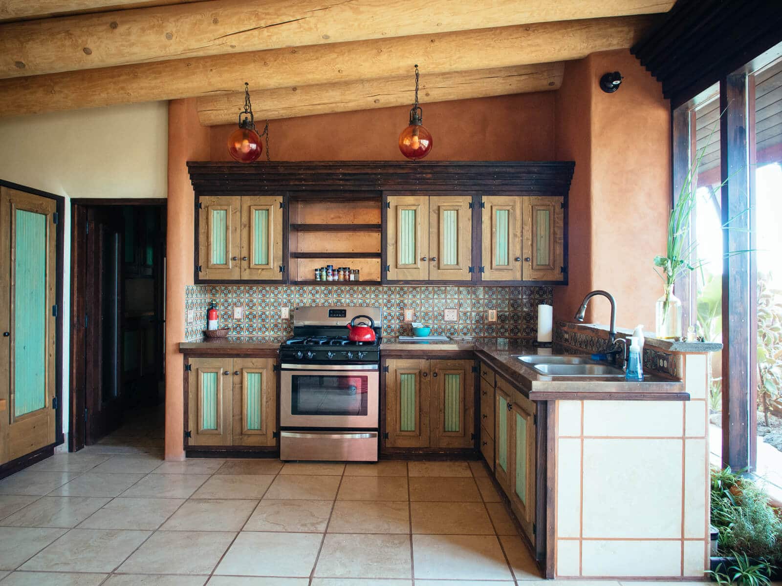 Earthship kitchen with all the amenities including copper countertops