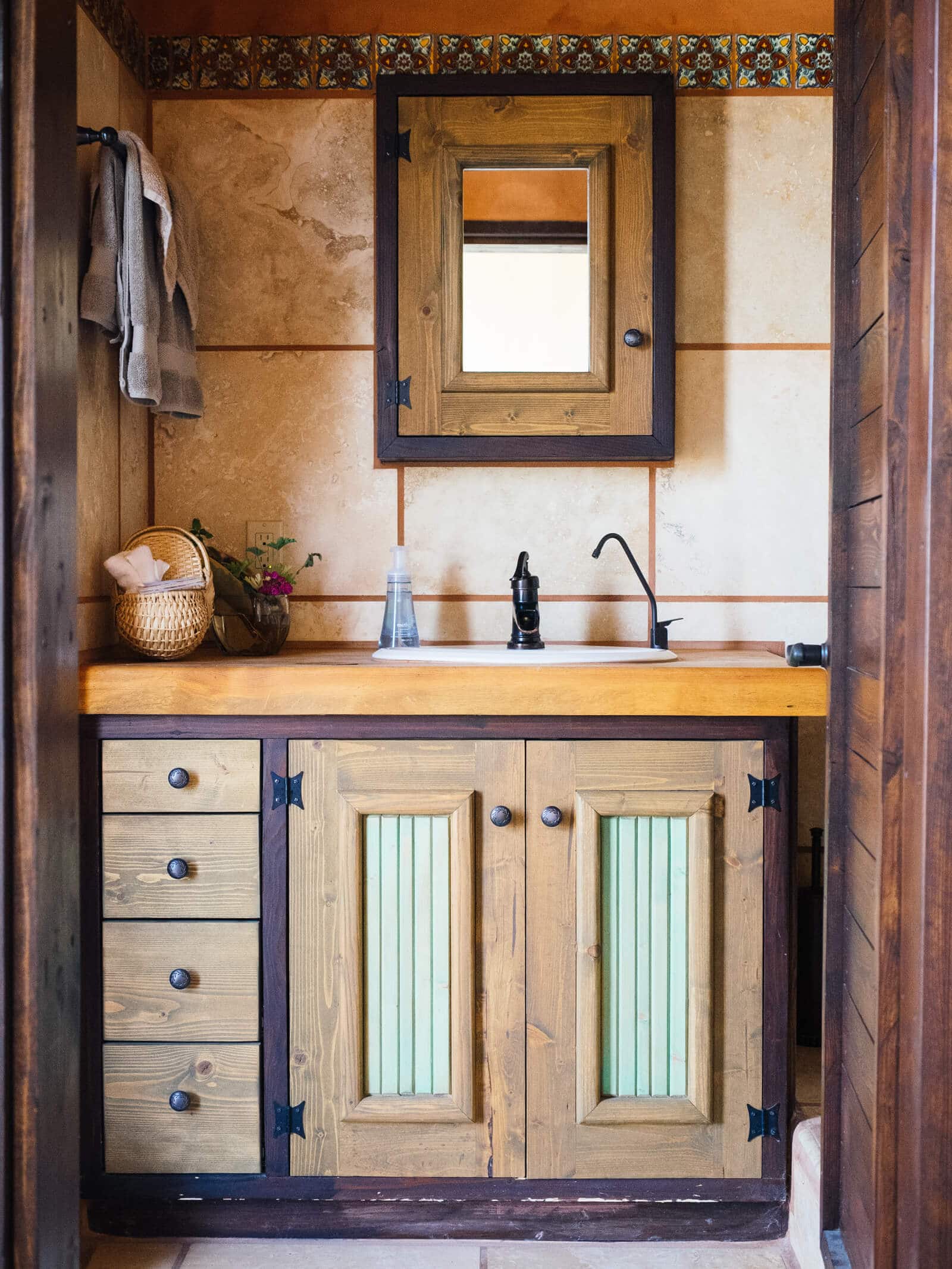 A rustic, handcrafted bathroom in an Earthsip