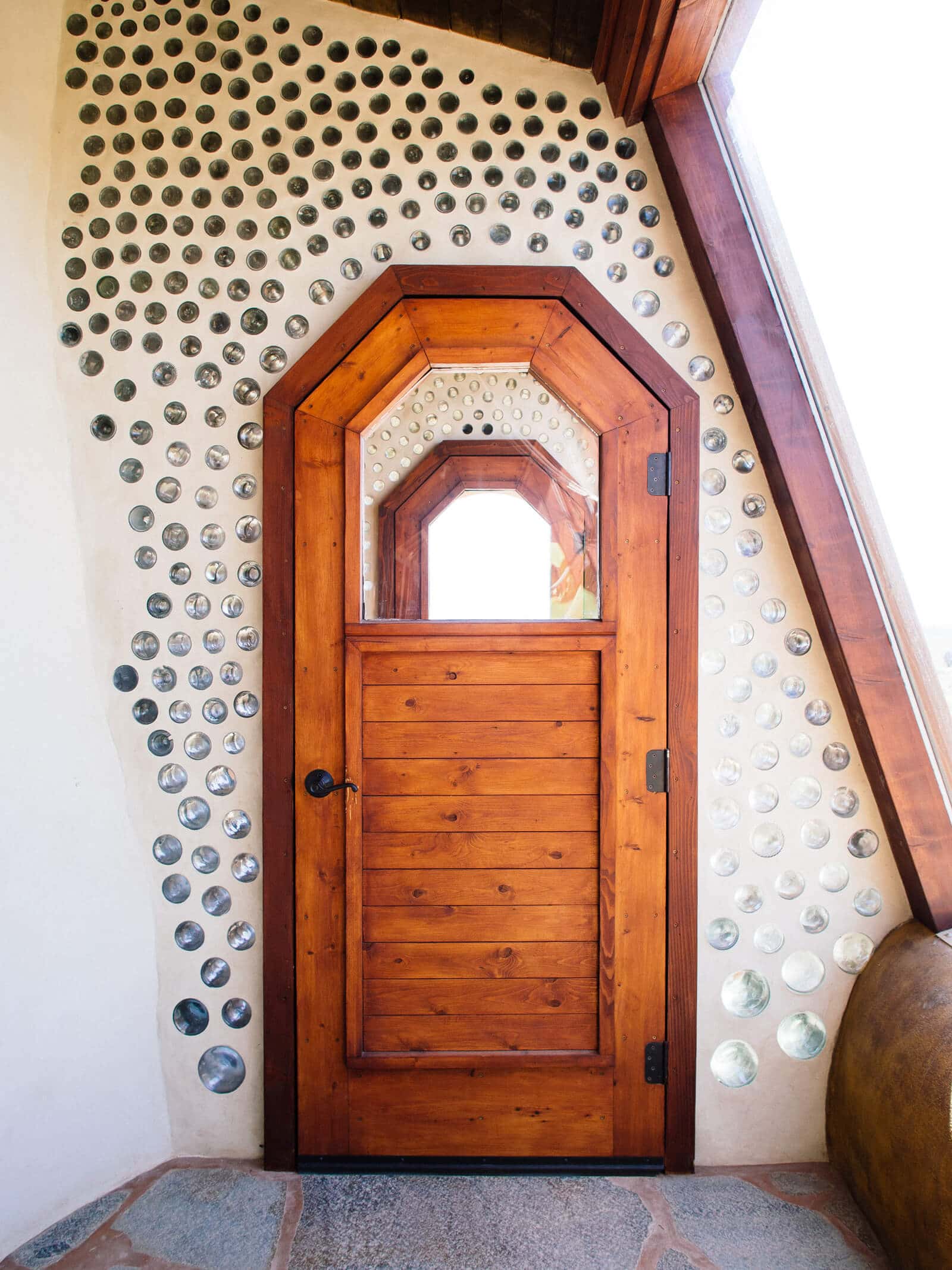 Reclaimed wood door in an Earthship house