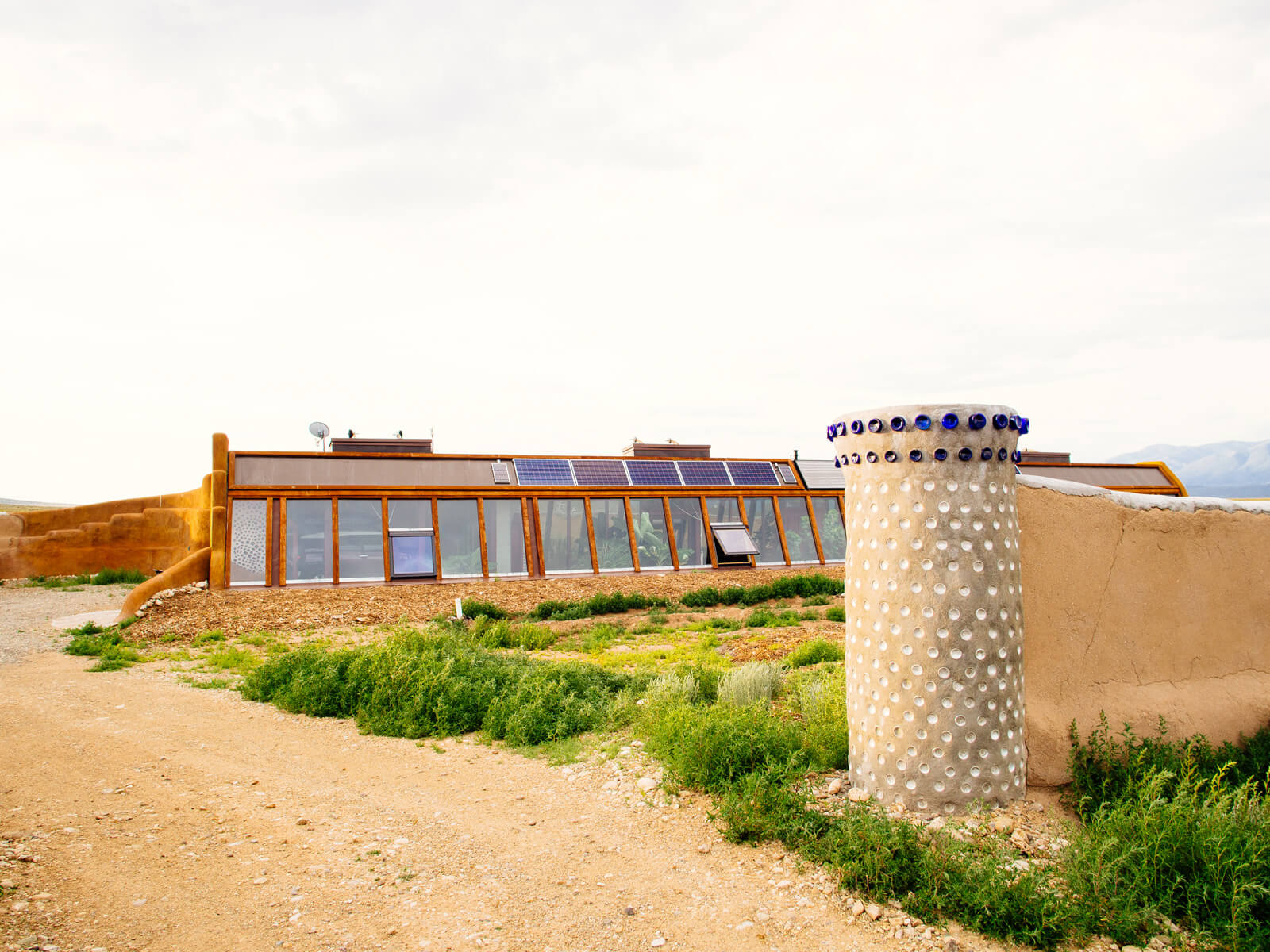 Waybee Earthship in New Mexico utilizing solar gain and thermal mass in its sustainable design