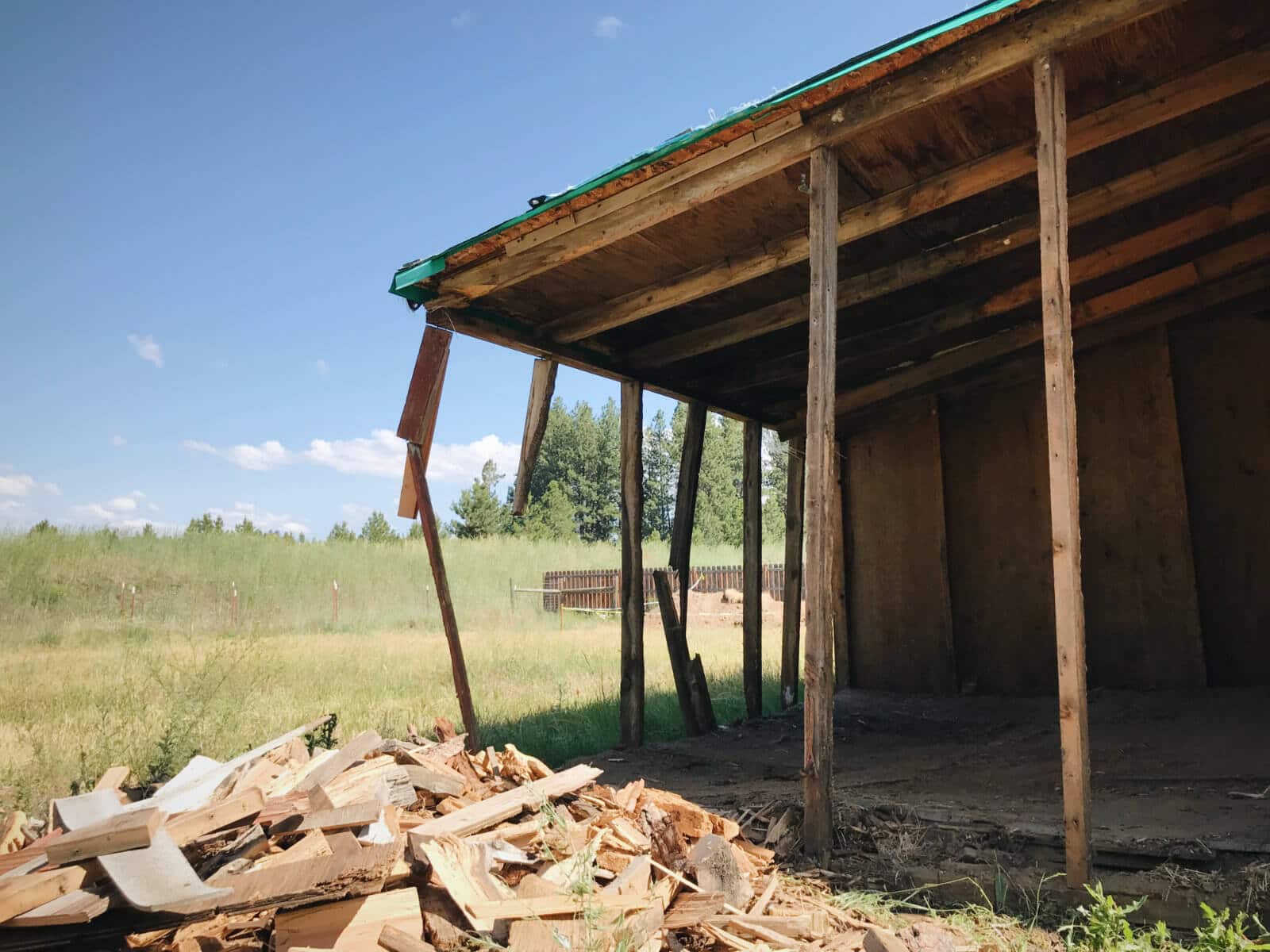 Tearing down the old wood sheds