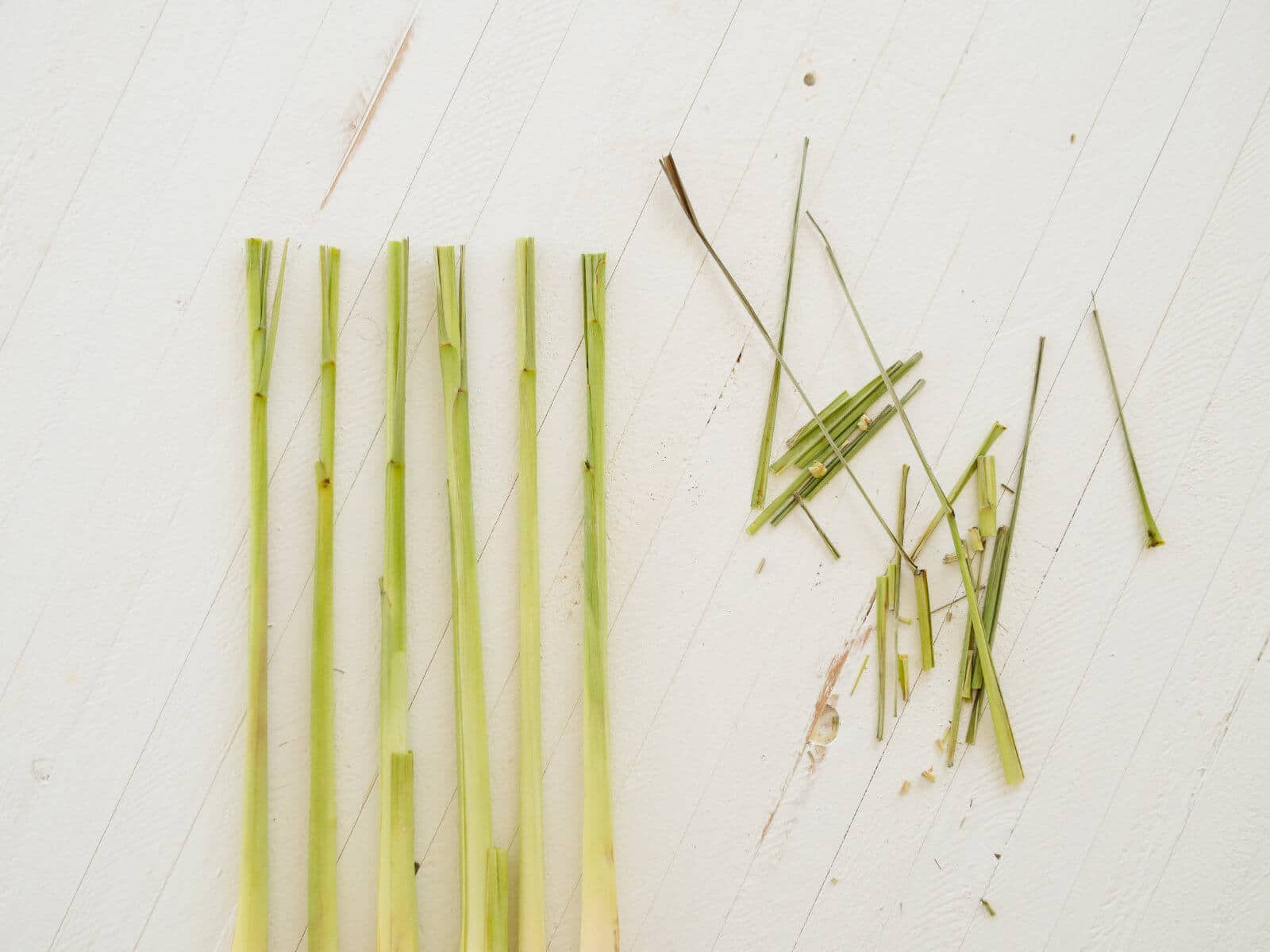 Cut off the tops of the lemongrass to remove any brown or older leaves
